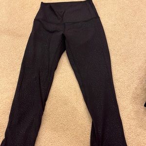 Lulu lemon black capris length leggings with pattern. Size 4